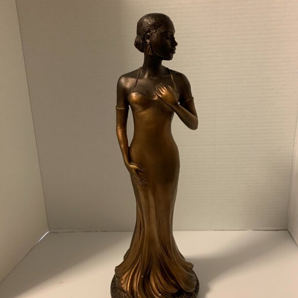 bronze and gold figurine